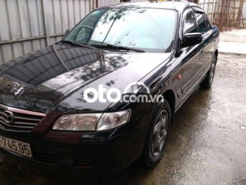 Mazda 626 MT 2001 - Cần bán lại xe Mazda 626 MT sản xuất năm 2001, màu đen
