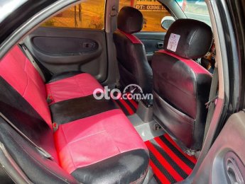 Kia Spectra 2002 - Cần bán xe Kia Spectra năm sản xuất 2002, màu đen chính chủ, 79tr