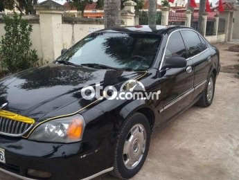 Daewoo Magnus 2004 - Bán Daewoo Magnus 2.0 năm 2004, màu đen số tự động