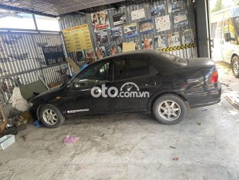 Mazda 323 1999 - Màu đen